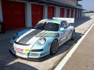 A 997 GT3 parked up on its own at the end of the pit lane